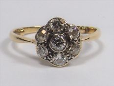 A Yellow Metal Diamond Daisy Ring