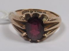 A 9ct Gold Ring With Garnet Stone