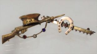 A 9ct Gold Horse Shoe Brooch With Ruby Stone Twinn
