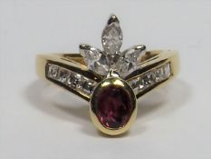 An 18ct Gold Ring With Marquise & Square Cut Diamo