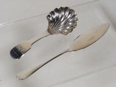 A Shell Shaped Silver Caddy Spoon Twinned With Sil
