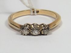 A 9ct Gold Ring With Three Diamonds