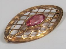 A Victorian Yellow Metal Brooch With Pink Stone