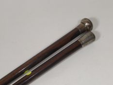 A Silver Topped Rosewood Walking Cane