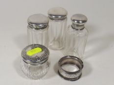 Three Silver Topped Scent Bottles, A Silver Topped