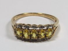 A 9ct Gold Citrine Ring With Small Diamonds