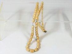 A Set Of 19thC. Carved Bone Beads