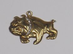 A Yellow Metal Bulldog Pendant With Small Diamonds