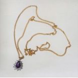 A 9ct Gold Necklace With Blue & White Stone Pendan