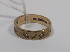 A 9ct Gold Band With White Stones