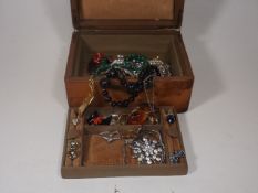 A Quantity Of Costume Jewellery In Antique Wooden