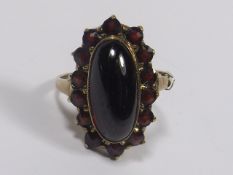 A 9ct Antique Gold Ring With A Cabochon Centre & C