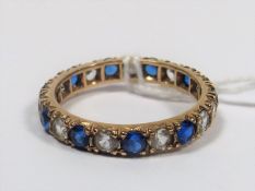 A Yellow Metal Eternity Style Ring With Blue & Whi