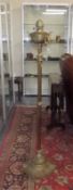A Floor Standing Brass Victorian Oil Lamp and a bo