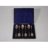 A Boxed Set Of Silver Teaspoons