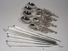 A Set Of Four White Metal Chinese Chopsticks With