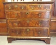 A George I Walnut Chest Of Five Drawers With Brack