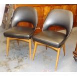 A Pair Of Retro Danish Style Leather Dining Chairs