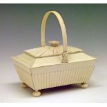 Regency Anglo-Indian ivory sarcophagus shaped sewing box having a swing handle, reeded decoration