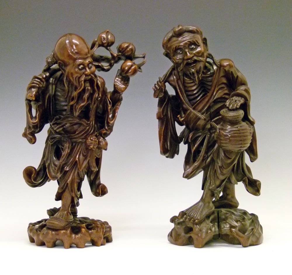 Two 19th Century Chinese carved hardwood figures depicting Fukurokuju, 40cm high and a Rakan, 39.5cm