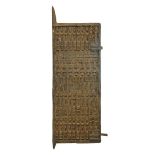 Ethnographica - West African door carved with four rows of figures, 150cm x 58cm exclusive of