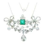 French diamond and emerald pendant brooch, the central stone approximately 6mm square, to a ribbon