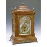 Early 20th Century oak cased bracket clock, the pagoda top with five brass pineapple finials, case