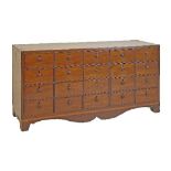 19th Century mahogany nest of twenty drawers, each having a turned wooden handle, standing on