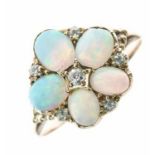 Five stone opal ring, with diamond points to the centre and edge, size Q, 2.9g gross Condition: