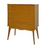 Modern Design - Alfred Cox walnut chest of five long graduated drawers, standing on high splayed