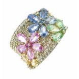 Diamond and gem stone floral motif dress ring, stamped '14k' and 'BH', the gem set flower heads to a