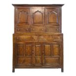 Mid 18th Century oak two section cupboard, probably Welsh, the upper section having a moulded