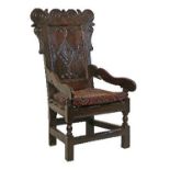 17th Century carved oak Wainscot chair having a wavy crest rail, ears with conforming decoration,