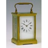 Late 19th/early 20th Century French brass Corniche cased carriage clock, the white enamel dial