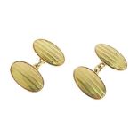 Pair of 18ct gold cufflinks, Birmingham 1924, the oval panels with linear decoration, chain link