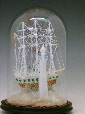 Nailsea type glass frigger in the form of two sailing ships and a lighthouse, displayed beneath a - Image 2 of 8