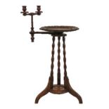 Late 19th/early 20th Century walnut and beech sewing table, the circular top having a carved border,