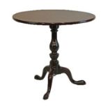 George III mahogany circular snap top supper table standing on a turned and carved pillar tripod