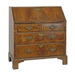 18th Century walnut bureau, having herringbone banding, fall flap with engraved brass escutcheon,