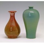 Two Chinese monochrome glazed vases, the red and green mottled glazed baluster shaped example