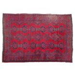 Mid 20th Century Turkey carpet having traditional geometric decoration on a red ground within