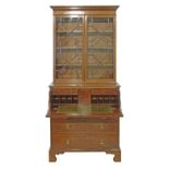 George III mahogany two section secretaire bookcase, the upper section fitted moulded cornice,