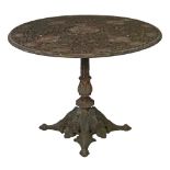 Cast iron circular top garden/conservatory table having pierced classical decoration and standing on