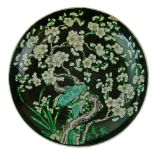 Chinese Famille Noir charger decorated with prunus blossom, underside with four character Kangxi