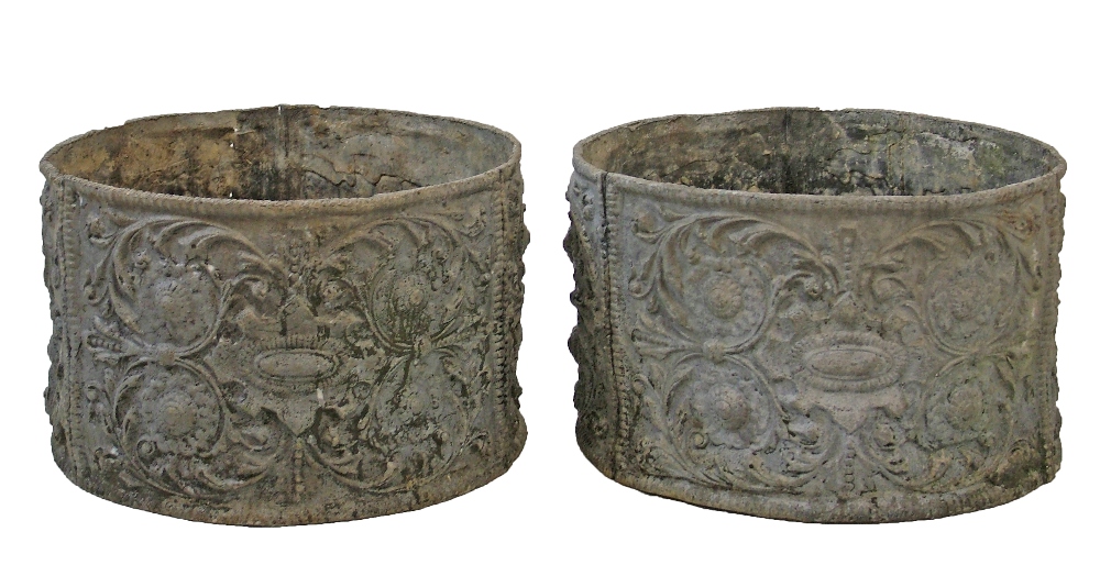 Pair of circular lead planters, having Neo-classical stylised foliate decoration, 33.5cm diameter