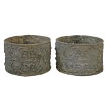 Pair of circular lead planters, having Neo-classical stylised foliate decoration, 33.5cm diameter