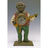 19th Century cast iron figural cased mantel clock, probably American, formed as a man playing a