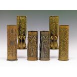 Trench Art - Six shell case vases comprising: two with Persian decoration 27.5cm high, a pair