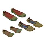 Three pairs of Chinese embroidered and tooled leather shoes, 17cm - 26cm long Condition: Somewhat