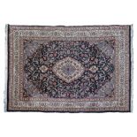 Good quality modern Middle Eastern carpet decorated with a central medallion on a stylised floral
